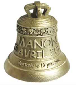 Decoration of a bronze bell for an original gift for a baptism